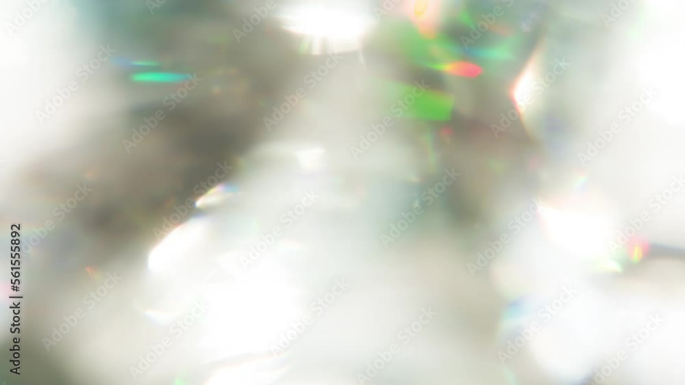 Wall mural light through the thickness of a diamond. loop. the light passes through the facets of a slowly rota