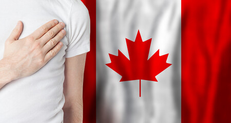 Fototapeta Canadian person with hand on heart on the background of Canada flag. Patriotism, country, national, pride concept obraz