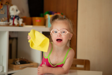 Girl with Down syndrome learns to clean up after games