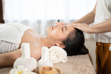 Obraz na płótnie Canvas Young Asian beauty woman enjoying massage and spa.