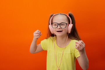 Girl with Down syndrome listens to music