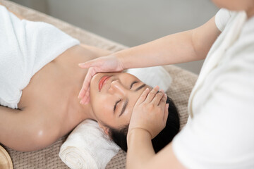 Young Asian beauty woman enjoying massage and spa.