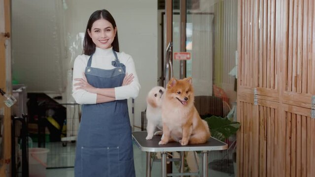 Portrait of Female professional groomer at pet spa grooming salon