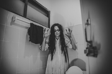 Portrait of asian woman make up ghost,Scary horror scene for background,Halloween festival concept,Ghost movies poster,angry spirit in the apartment © reewungjunerr