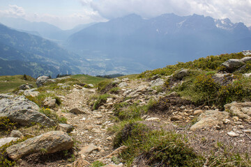 Landscape of Lienz Dolomites in Austria. Road and panorama of massive Alpine mountains
