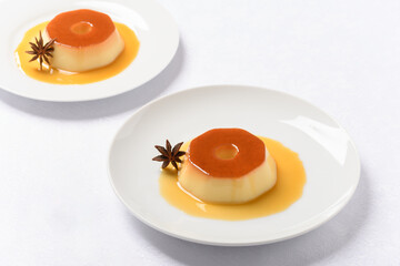 pudding on a white plate, a typical Brazilian dessert and white background