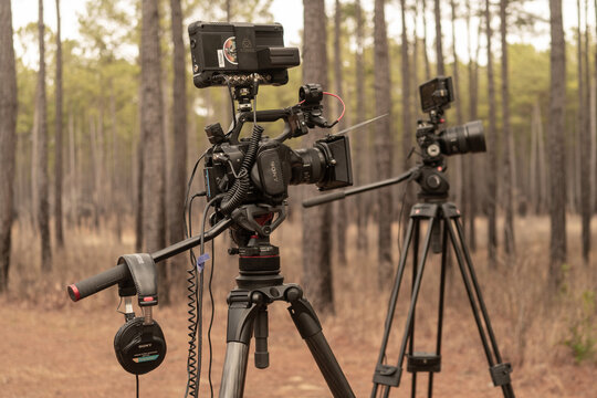 Wakefield, Virginia US - January 12, 2023: Headphones hang from a tripod arm, awaiting the two camera shoot director, cinematographer, operator return to the interview location to begin filming