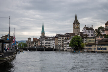 Fototapeta na wymiar Cloudy city view along Lake Zurich