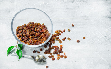 Raisins in a glass bowl.