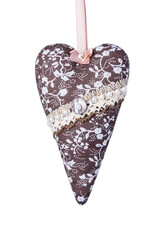 Fabric elongated heart isolated PNG. Handmade textile heart made of brown fabric with white flowers on a satin ribbon. Heart is decorated with a lace ribbon and beads. Valentine's day concept.