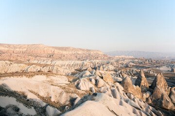 Fototapeta na wymiar Stunning Cappadocia landscape with the rock formations during a sunny day. Red & Rose Valley, Cappadocia, central Anatolia, Turkey