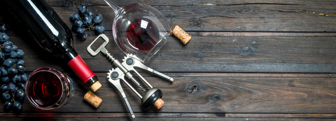 Wine background. Red wine with corkscrew.