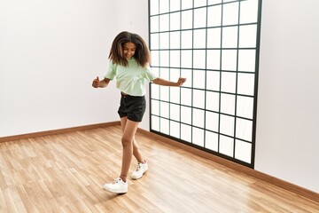 African american girl smiling confident dancing at dance school