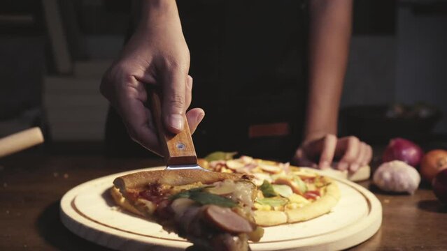 Close up homemade pizza on the table, fast food cooking in the kitchen at home, Food Fottage Clip.