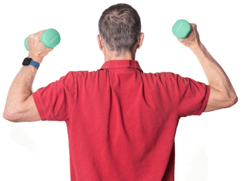 Senior man in red shirt exercising with arm or hand weights and isolated against white background - Powered by Adobe