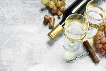 Wine background. White wine with grapes.