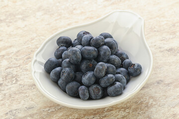 Sweet ripe blueberry heap in the bowl