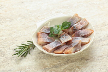Delicous sliced herring fillet in grape sauce