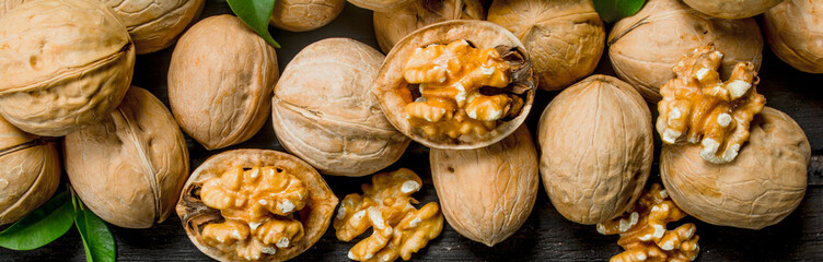 Peeled walnut with leaves .