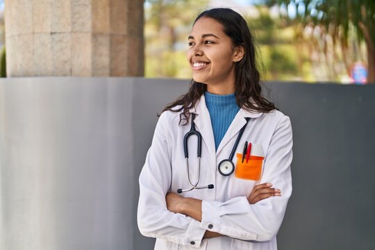 Young African American Woman Doctor Standing With Arms Crossed Gesture At Street