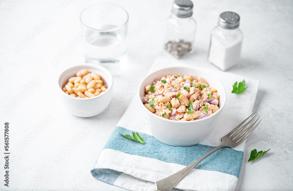 Wall mural Cooked salmon white bean red onion salad in a bowl