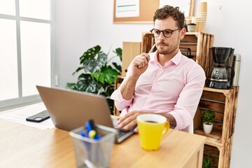 Young hispanic man working concentrate at office