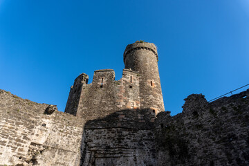 Fototapeta na wymiar Conwy, North Wales, United Kingdom -2023: Conwy Castle fortification built by Edward I, during his conquest of Wales. Prison tower and crenelated walls. 
