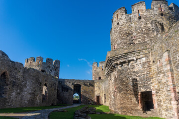 Conwy, North Wales, United Kingdom: Conwy Castle fortification built by Edward I, during his conquest of Wales. Outer Ward, Site of Kitchen and Stables. Ancient stone walls and towers. 