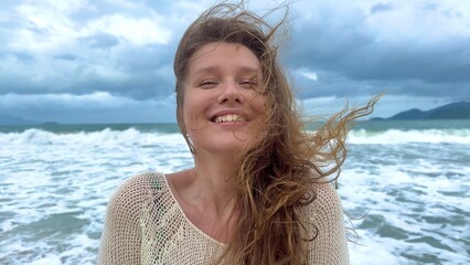 Portrait of beautiful girl, young happy positive cheerful joyful woman enjoying vacation on sea,...
