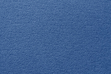 Soft surface mat for gymnastics. Blue background with texture. Synthetic material. Photo closeup