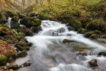 Long exposure of a waterfall on the Hoar Oak Water river at Watersmeet in Exmoor National Park