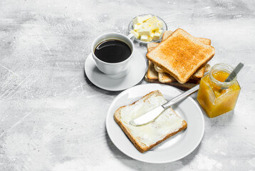 Toasted bread with butter and hot coffee.