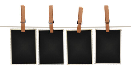 blank photos hanging on rope