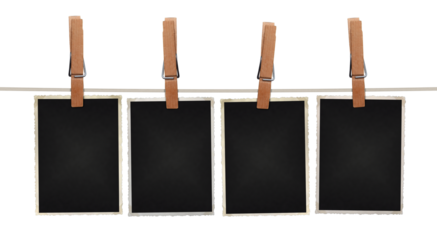 blank photos hanging on rope