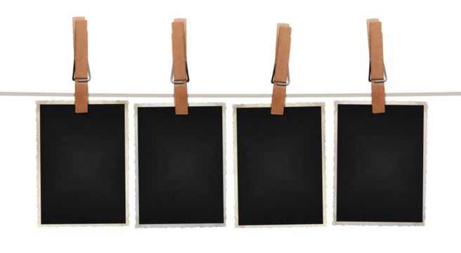 blank photos hanging on rope