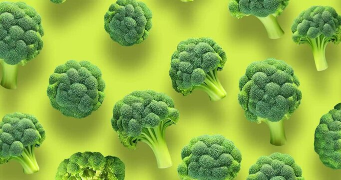 Broccoli stop motion pattern on yellow background Vegan food Green broccoli Loop 4k Space for text