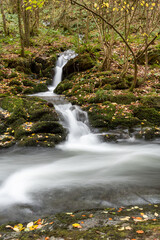 Long exposure of a waterfall on the East Lyn river at Watersmeet in Exmoor National Park