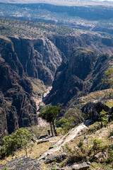 Canyon with narrow river and jagged rocks