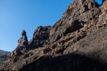 Rocky cliff with jagged brown rocks