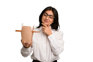 Young business indian woman eating takeaway noodles cut out isolated looking sideways with doubtful and skeptical expression. - obrazy, fototapety, plakaty