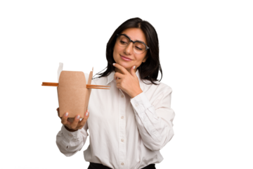 Young business indian woman eating takeaway noodles cut out isolated looking sideways with doubtful and skeptical expression.