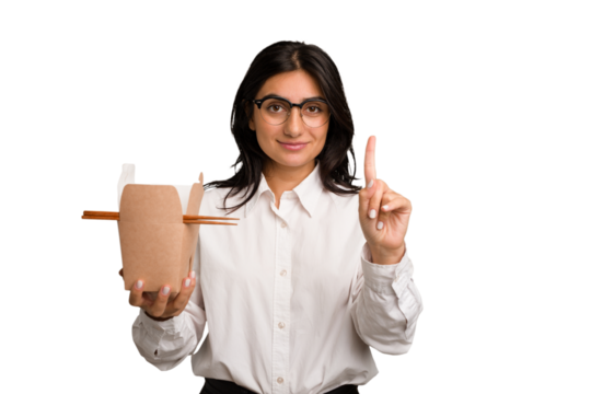 Young business indian woman eating takeaway noodles cut out isolated showing number one with finger.