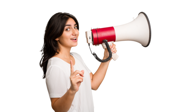 Young Indian woman holding a megaphone isolated