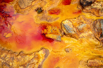 Red colored waters of the Rio Tinto in Huelva, Spain, due to mining and the iron that its waters...