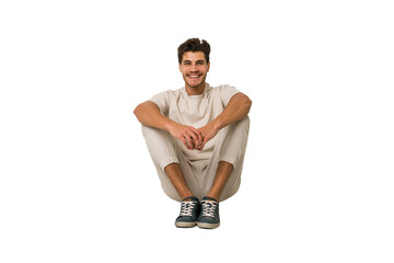 Young caucasian man sitting on the floor isolated on white background
