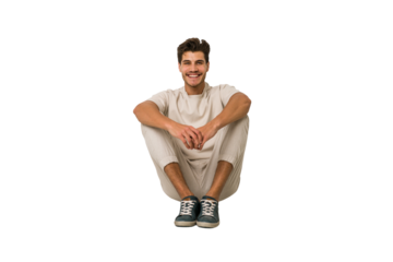 Young caucasian man sitting on the floor isolated on white background
