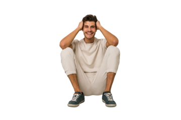 Young caucasian man sitting on the floor isolated on white background