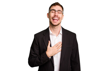 Young caucasian business man cutout isolated laughs out loudly keeping hand on chest.