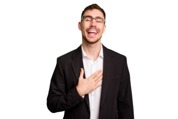 Young caucasian business man cutout isolated laughs out loudly keeping hand on chest.