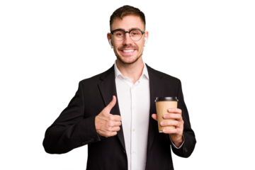 Young business caucasian man drinking a coffee isolated cutout smiling and raising thumb up